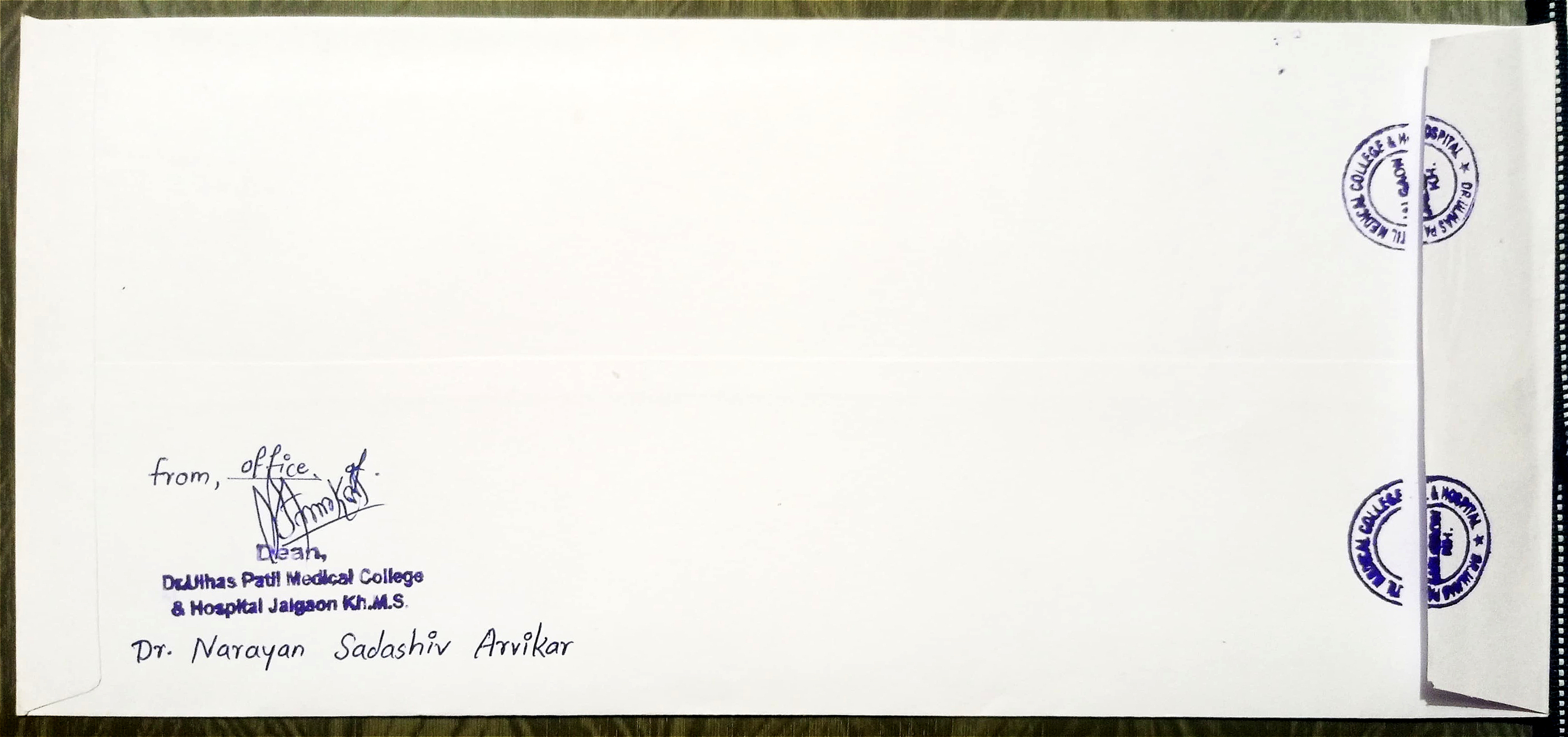 The back of an envelope with sender details from a medical college.